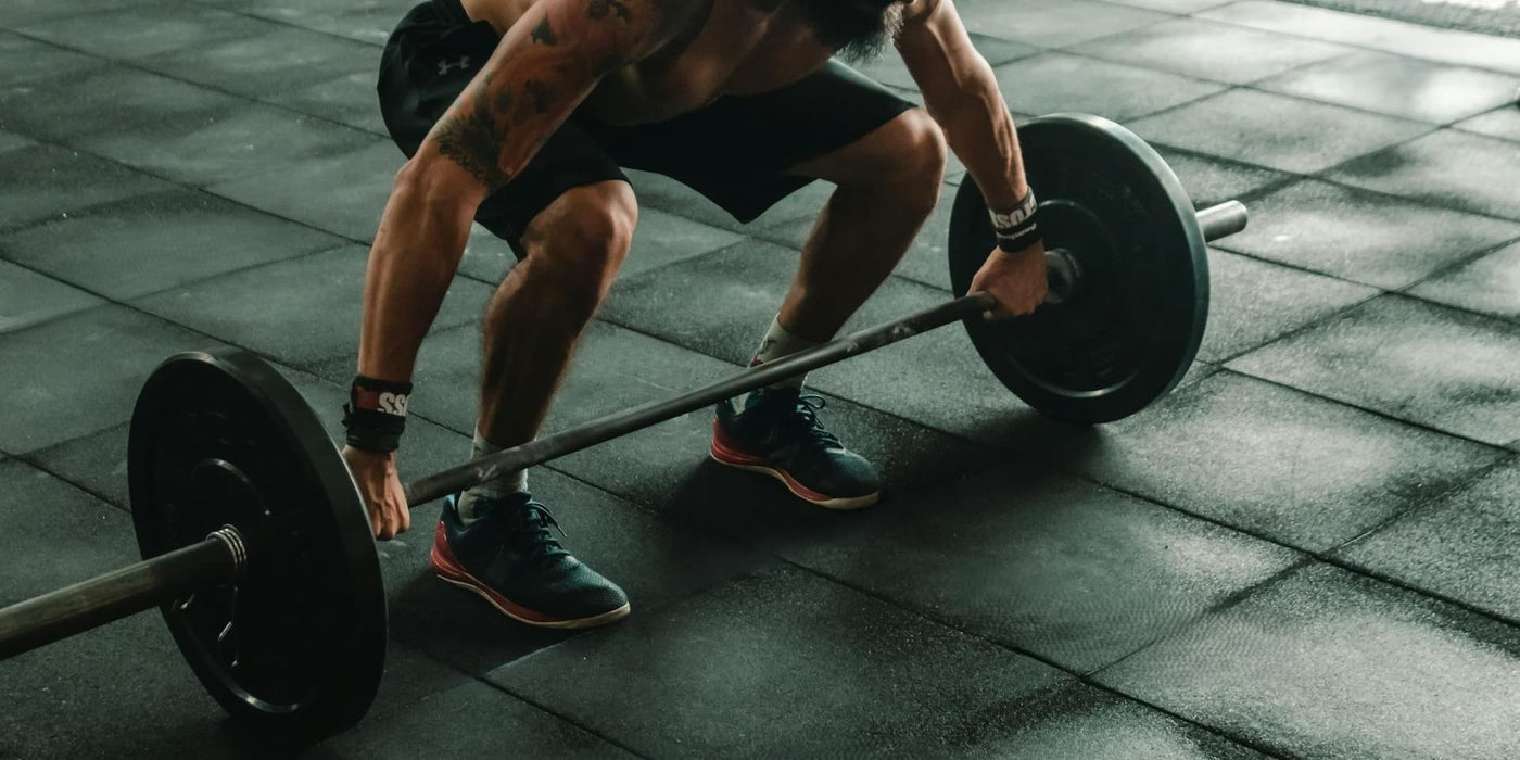 athletic recovery homepage banner crossfit athlete preparing dead lift in gym